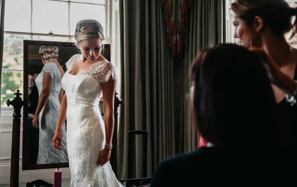 Wedding Photo RM - bride checks dress