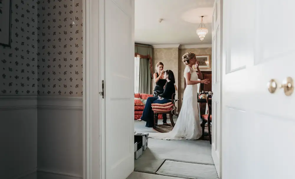 Wedding Photo RM - view of bride through doorway